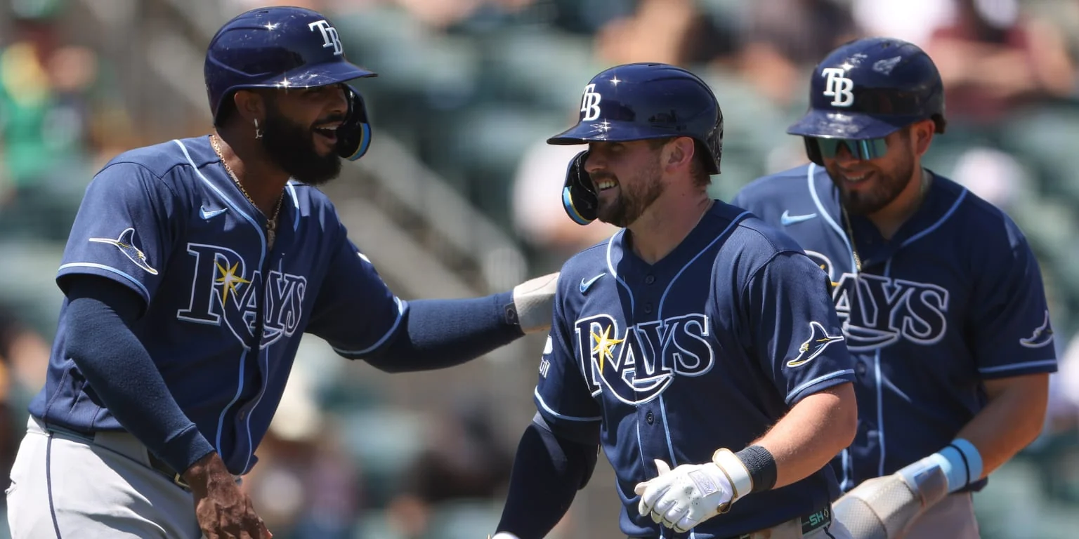 Tampa Bay Rays players celebrate during an August 2026 regular-season game